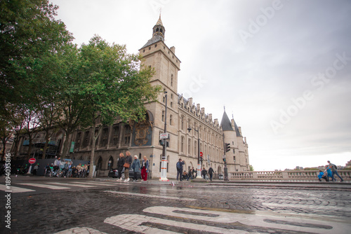 Low angle view of a historic riverside building and wet street