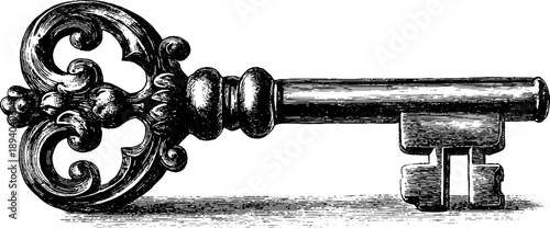 Ornate antique metal key with botanical handle engraving from the 19th century for vintage design