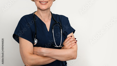 Quadro em tela Professional female doctor in uniform with stethoscope poses confidently for car