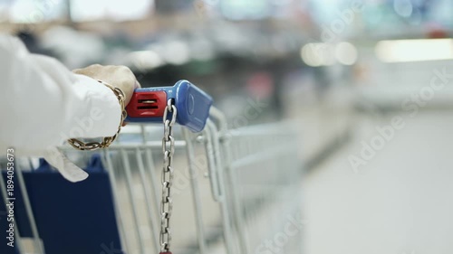 Women housewife with cart shopping in supermarket, slow motion