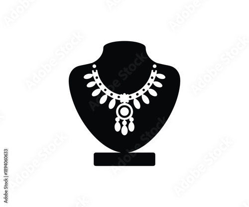 White necklace on black jewelry display stand