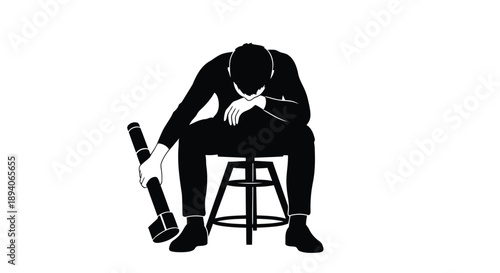 Professional in distress sitting alone on a stool reflecting deep thought or fatigue in monochrome silhouette