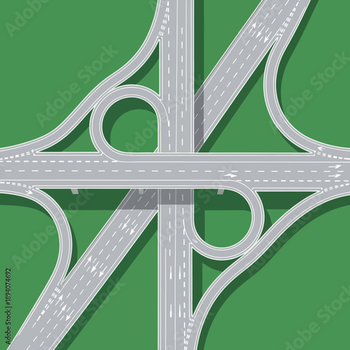 Aerial View of Highway Interchange with Green Landscape and Shadow