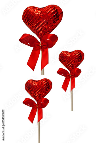 Three heart shaped lollipops on a white background
