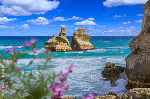 Torre dell'Orso beach with the sea stack Due Sorelle in Apulia region, southern Italy.