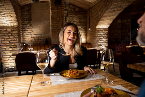Woman enjoys dinner with fr...