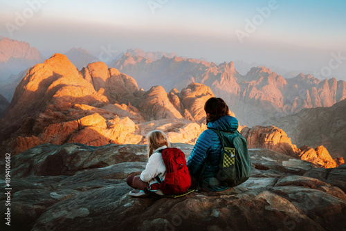 Family father and child hiking in mountains travel vacation weekend outdoor dad with child on camping tour together active healthy lifestyle hobby adventure trip parent and kid enjoying views in Egypt