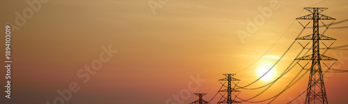 Wallpaper Mural Sunset silhouette of power lines and electricity pylons against a warm, orange sky. A dramatic representation of energy and infrastructure Torontodigital.ca