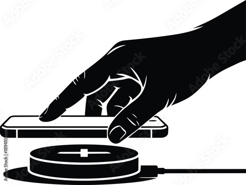 Hand placing smartphone on wireless charging pad with cable charger