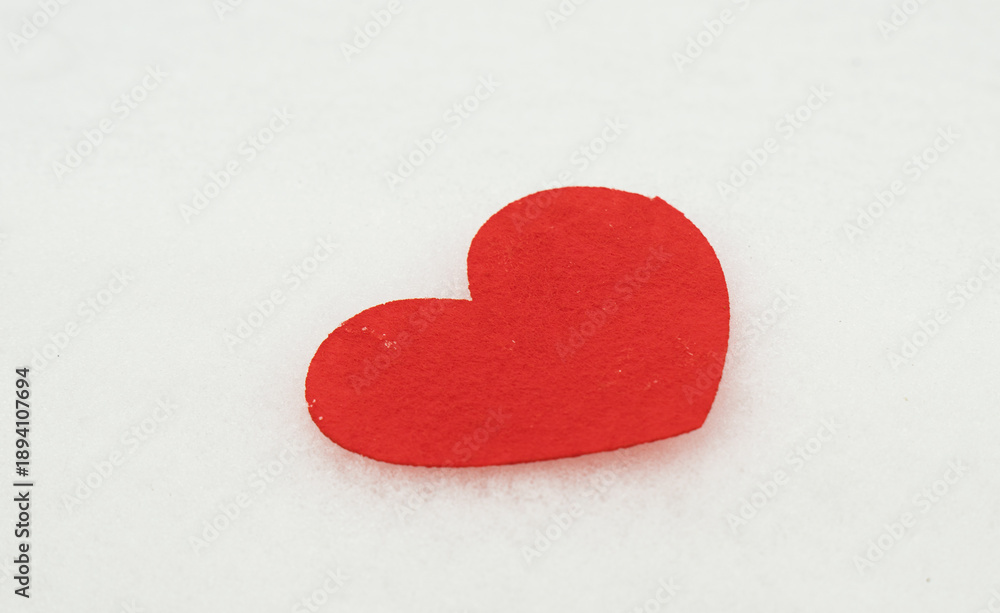Fototapeta premium red hearts on the snow=