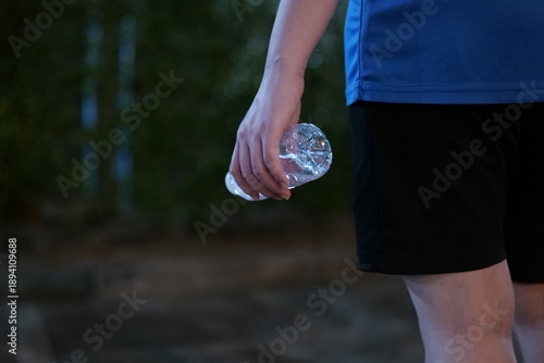 Woman Drinking Water After Outdoor Exercise