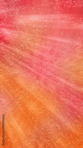 An abstract warm tone light ray laser beam blur vertical motion graphic background design.