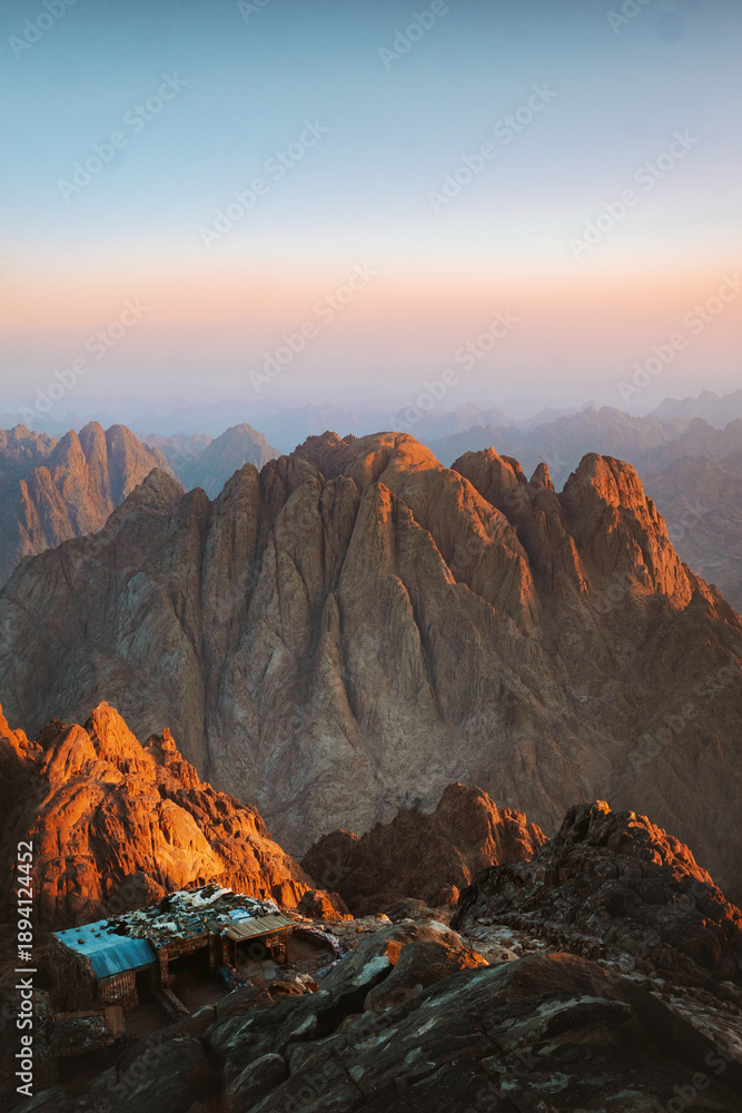 Naklejka premium Egypt landscape - mountain of Moses and traditional bedouin hut aerial view, famous Christian landmark in Sinai peninsula travel epic destinations, Jabal Mousa beautiful sunrise rocks scenery