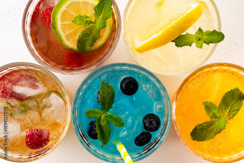Refreshing summer drinks with ice, fruit and mint, offering colorful beverages for a healthy lifestyle