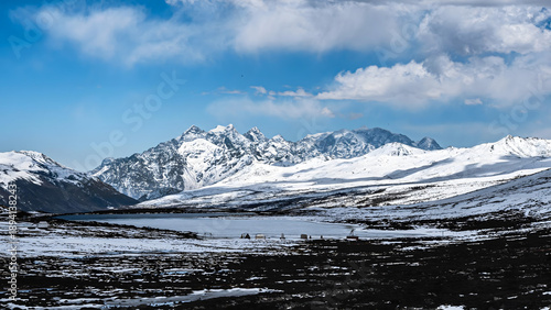 Photos Alpine Wilderness: Snow-Covered Mountain Peaks and Glacial Valley