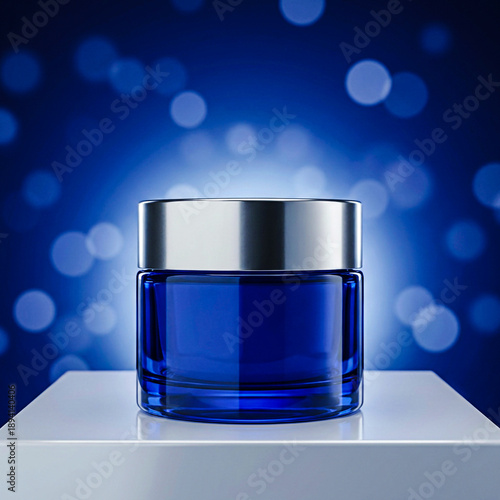 Blue Cosmetic Cream Jar with Metallic Lid on White Podium Against Blue Bokeh