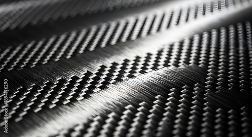 Wallpaper Mural A close-up view of dark carbon fiber showing its strong, woven texture and reflective surface Torontodigital.ca