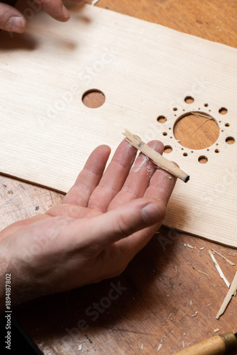 The master holds a piece of horsetail in his hand for polishing