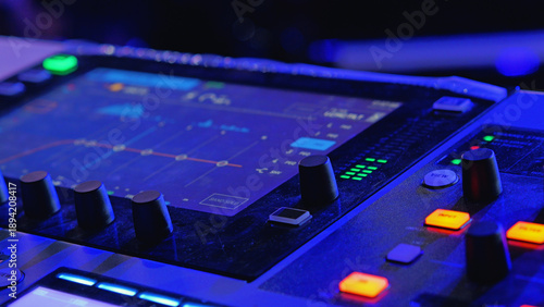 Photography Close-up of a digital soundboard for music production or live events