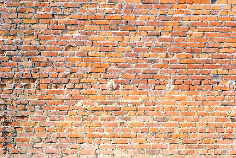 Naklejka premium Grunge orange brick wall background texture