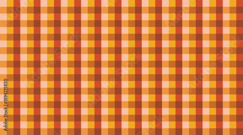 A seamless, warm orange, yellow, and brown checkered pattern. This classic gingham or plaid design provides a versatile, autumnal background for various projects.