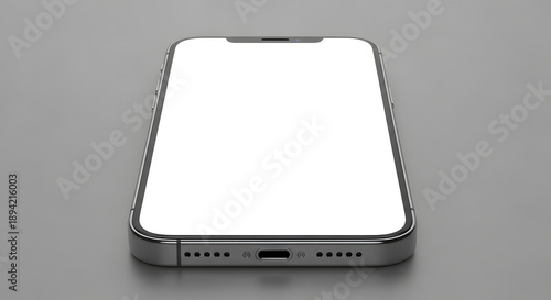Modern smartphone lying flat on a clean gray surface with isolated white screen ready for mockup
