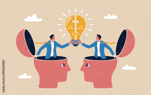 Two businessmen collaboratively creating a bright idea puzzle lightbulb from open minds