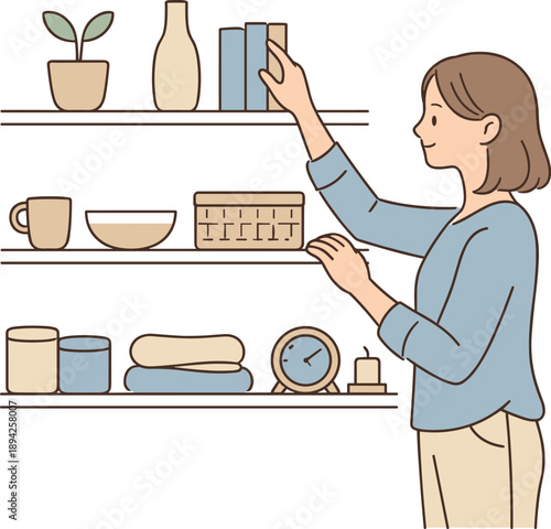Woman arranging home shelves neatly, standing calmly and placing items in order with relaxed posture and focused