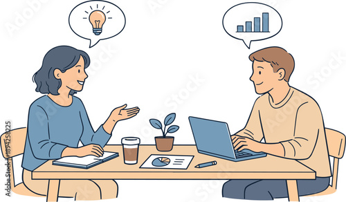 Team meeting in an office workspace, two professionals sitting at a table and discussing ideas with relaxed