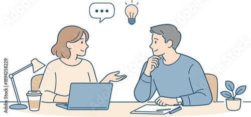 People collaborating in a modern office, two professionals sitting at a shared desk and discussing ideas with