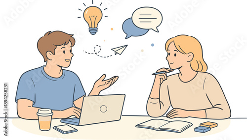 Startup team brainstorming ideas together, two young professionals sitting at a table and exchanging thoughts