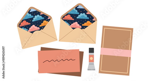 Envelope and card collection displayed with stationery and ink on white surface from directly above