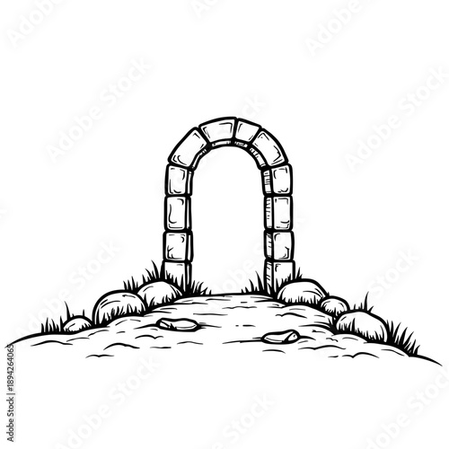 Stone archway leading to a path surrounded by grass and rocks  