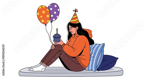 Woman celebrating birthday with balloons and cake while sitting on a mattress with pillows