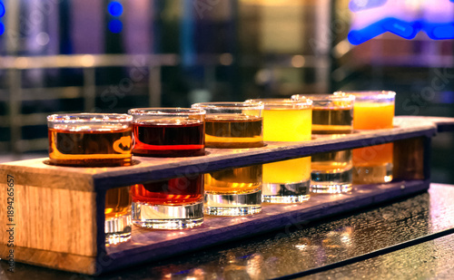 Wallpaper Mural Set of different alcoholic drinks in glass glasses at night lighting in a restaurant Torontodigital.ca