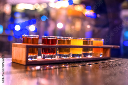 Wallpaper Mural Set of different alcoholic drinks in glass glasses at night lighting in a restaurant Torontodigital.ca