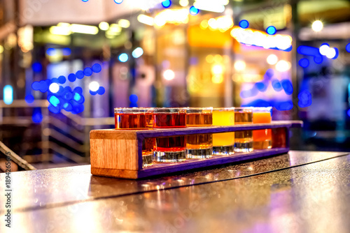 Wallpaper Mural Set of different alcoholic drinks in glass glasses at night lighting in a restaurant Torontodigital.ca