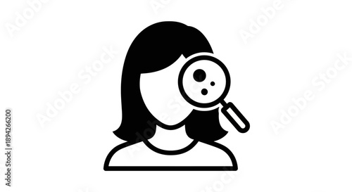 Woman examining details closely with a magnifying glass