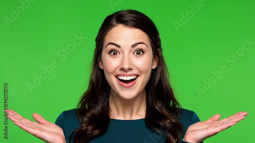 Stunning woman with surprised expression on green background
