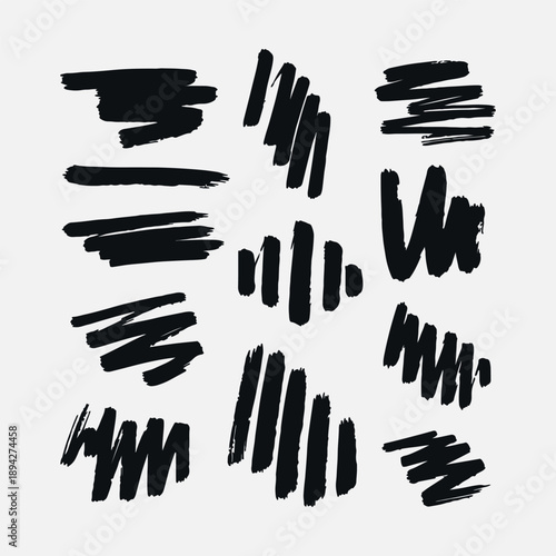 Collection of black hand drawn brush strokes and ink textures isolated on white background for artistic design elements