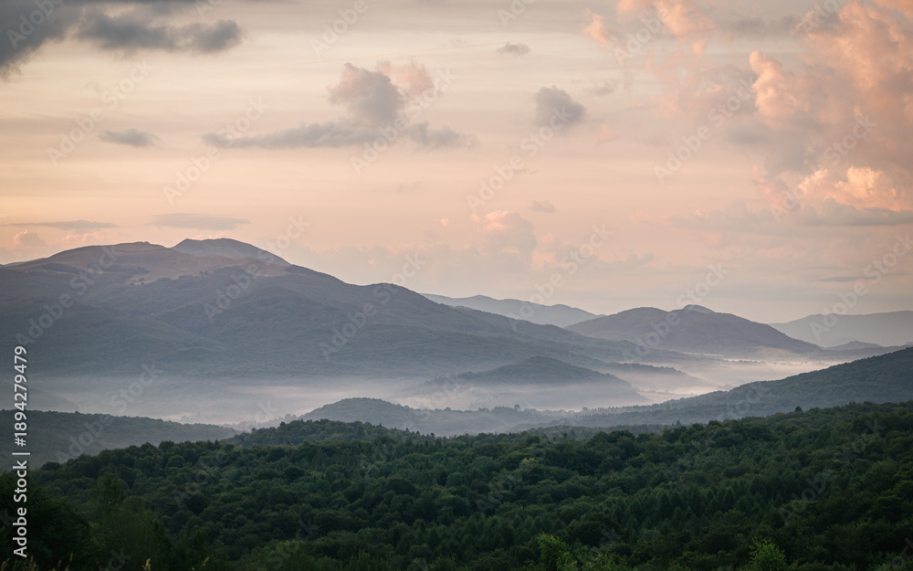 Fototapeta premium Misty mountain ridges at sunrise, Tarnica peak in Bieszczady Mountains, Poland