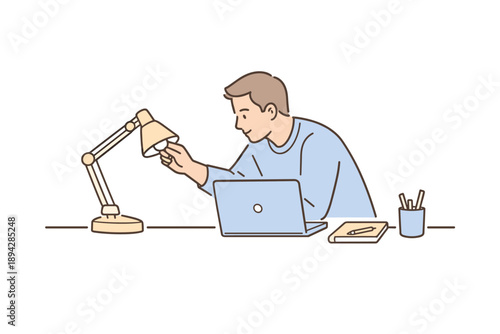 Focused Workspace Adjustment. Man tuning the desk lamp angle at a tidy workspace, slight lean forward and focused gesture