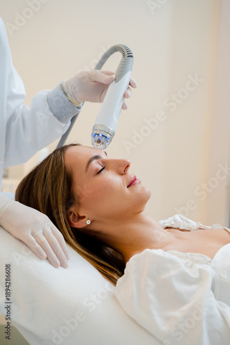 Картината върху платно Fractional RF needle facial lifting using professional radiofrequency cosmetology equipment