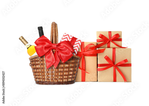 Gift basket with wine and presents isolated on white