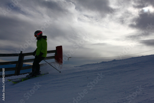Skiers Going Down a Snowy Slope at Ski Resort in Winter
