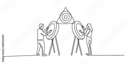 Businesspeople working together towards a central objective symbolized by targets