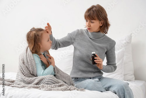Mother with cough syrup che...