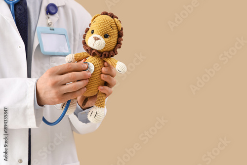 Male pediatrician with stet...