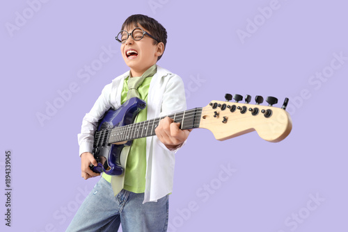 Cute boy in eyeglasses play...