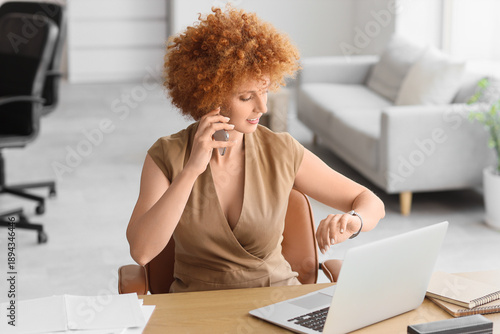 Redhead businesswoman with ...